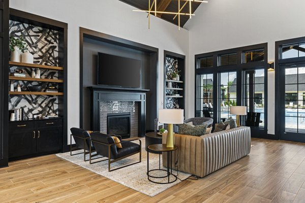 Living room with contemporary decor and ample natural light at The Gabriel Apartments, luxury rental in downtown area