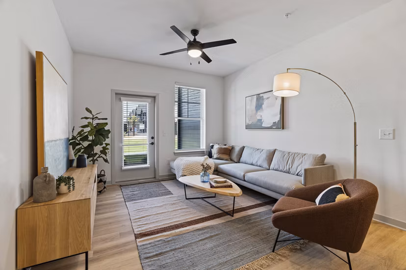Luxury living room with modern decor and natural light at The Gabriel Apartments, Greystar community