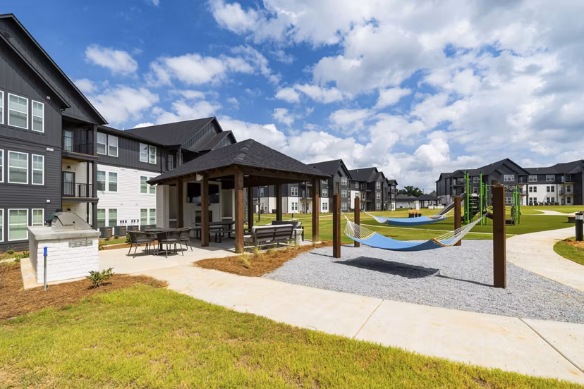 Chic patio with modern seating and greenery at The Gabriel Apartments, a luxury Greystar property