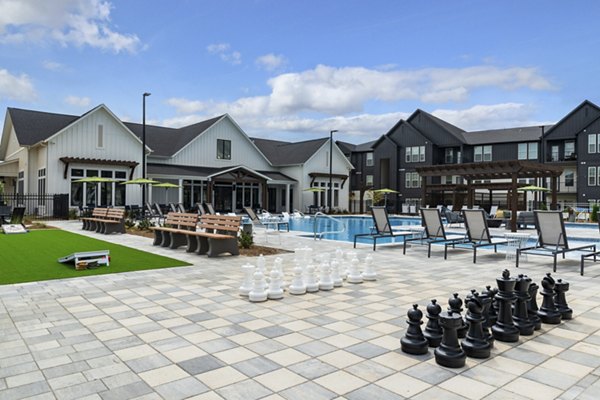 Chic outdoor patio with modern seating at The Gabriel Apartments, luxury living spaces in prime urban location