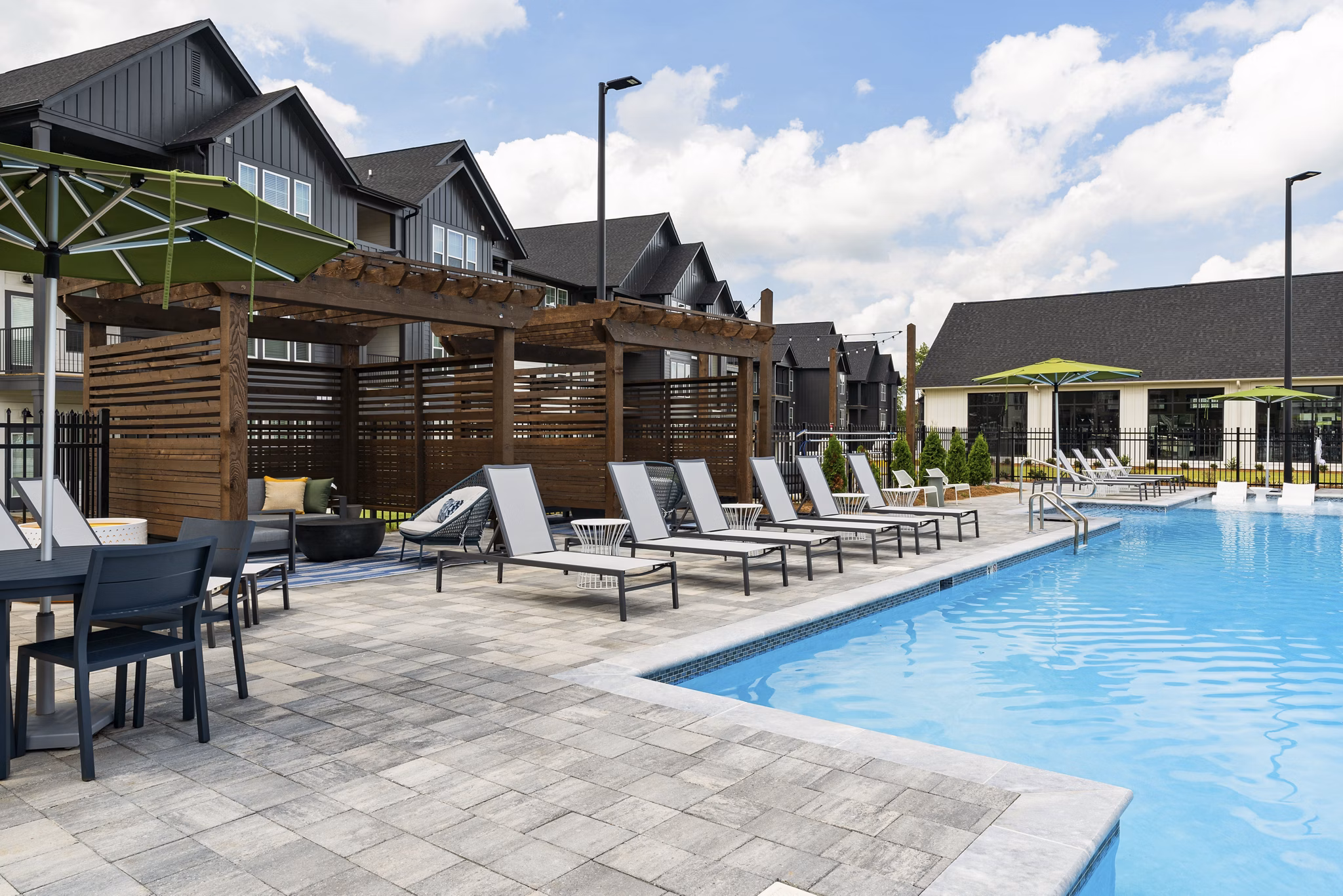 Luxurious pool with lounge chairs at The Gabriel Apartments, a  luxury property
