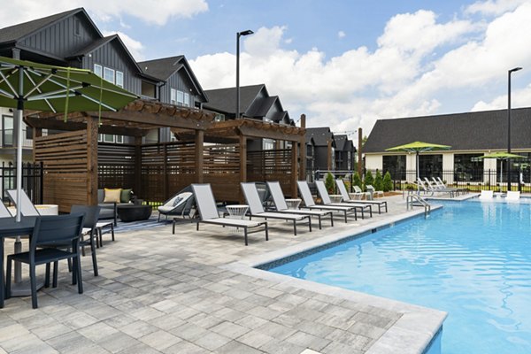 Luxurious pool with lounge chairs at The Gabriel Apartments, a  luxury property