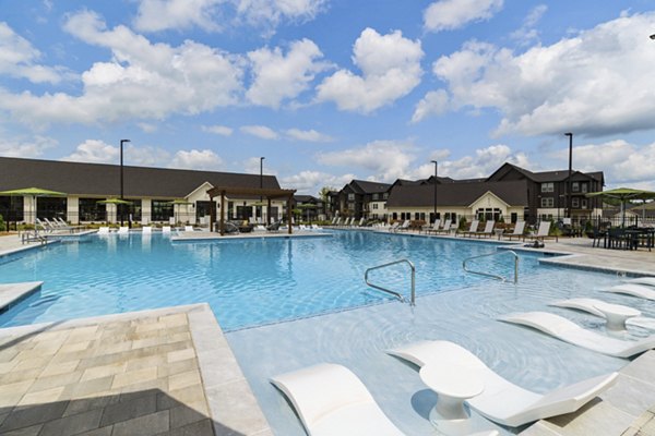 Resort-style pool with sun loungers at The Gabriel Apartments, luxury living in the heart of the city