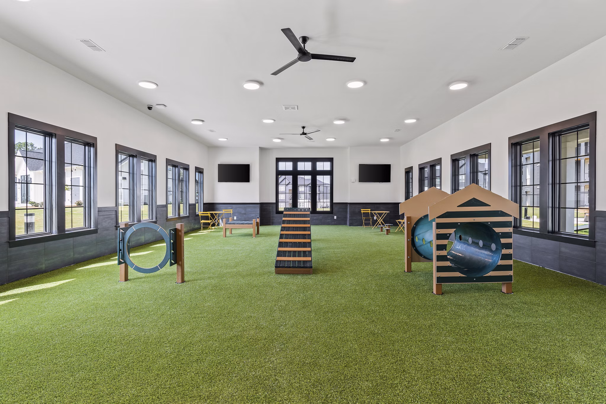 Inviting recreational area featuring lush landscaping and seating at The Gabriel Apartments