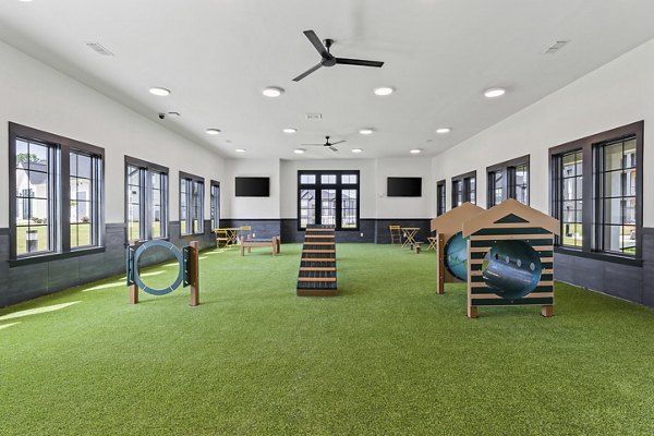 Inviting recreational area featuring lush landscaping and seating at The Gabriel Apartments