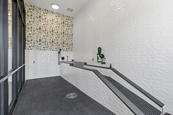 Recreational area featuring modern seating and gaming tables at The Gabriel Apartments