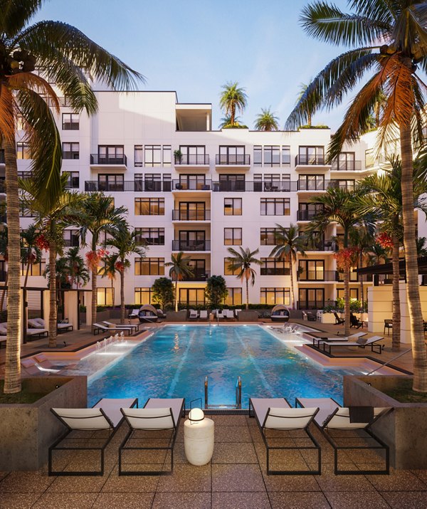 Luxurious pool area with sun loungers at Aster & Links Apartments, perfect for relaxation and leisure activities