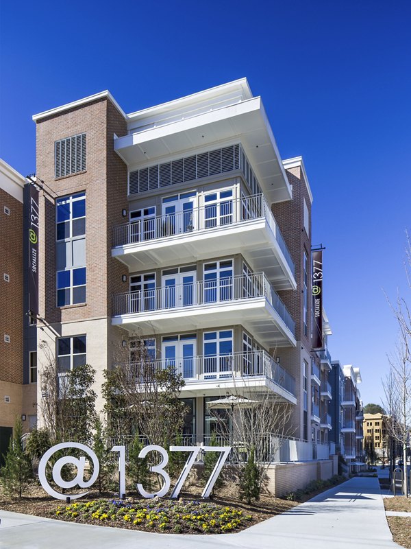 1377 Apartments: Elegant facade of luxury apartments in a vibrant urban neighborhood