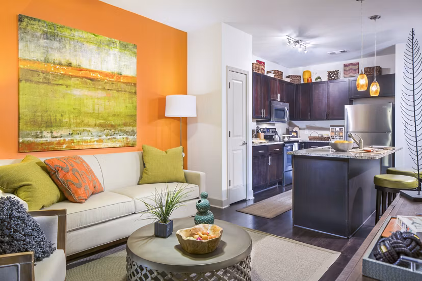 Spacious living room with modern decor and natural light at 1377 Apartments, a luxury community by Greystar