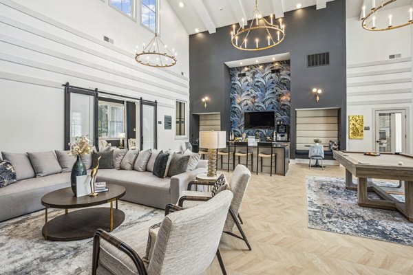 Clubhouse with modern lounge furniture at 4000 Margaret Apartments