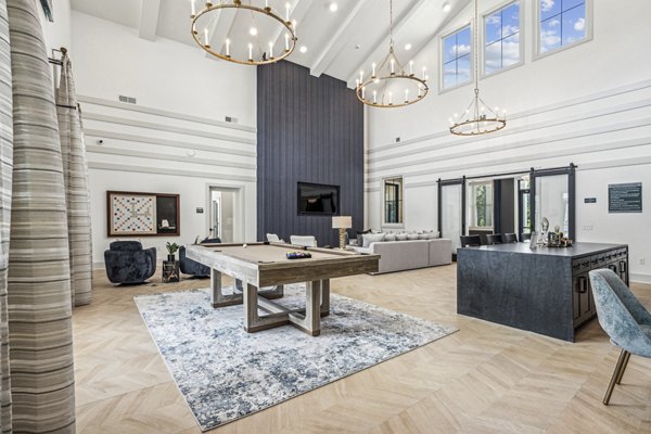 Clubhouse with modern design and comfortable seating at 4000 Margaret Apartments, a luxury community by Greystar