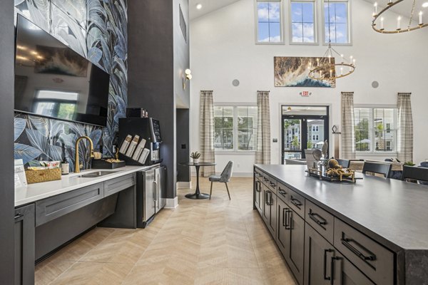 Clubhouse featuring plush seating and billiards at 4000 Margaret Apartments, a Greystar luxury community