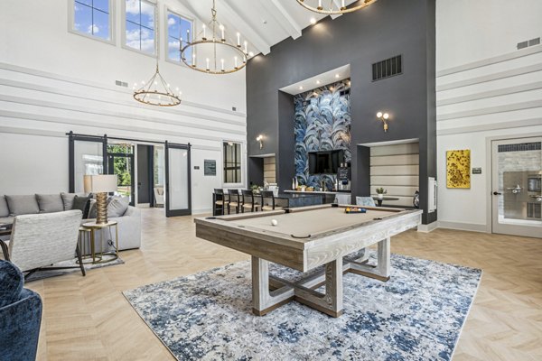 Chic clubhouse with modern furnishings at 4000 Margaret Apartments, perfect for social gatherings and resident events