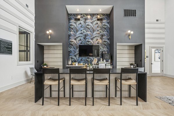 Dining room with modern decor and elegant lighting at 4000 Margaret Apartments luxury Greystar apartment community