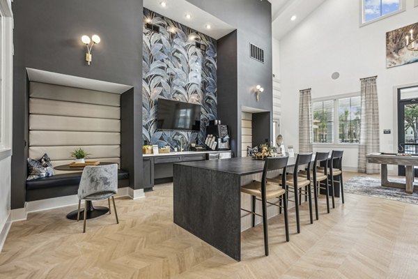 Elegant dining room with stylish lighting and modern furniture in 4000 Margaret Apartments, offering luxury living in a prime location