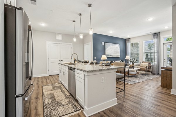 Dining room with modern decor and natural lighting at 4000 Margaret Luxury Apartments
