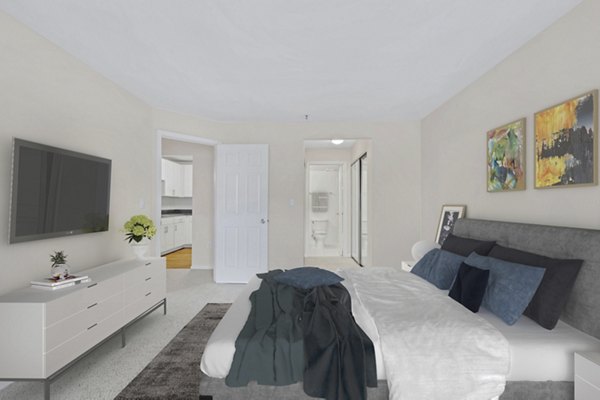 Cozy bedroom with modern furnishings at Columbia Crossing Apartments