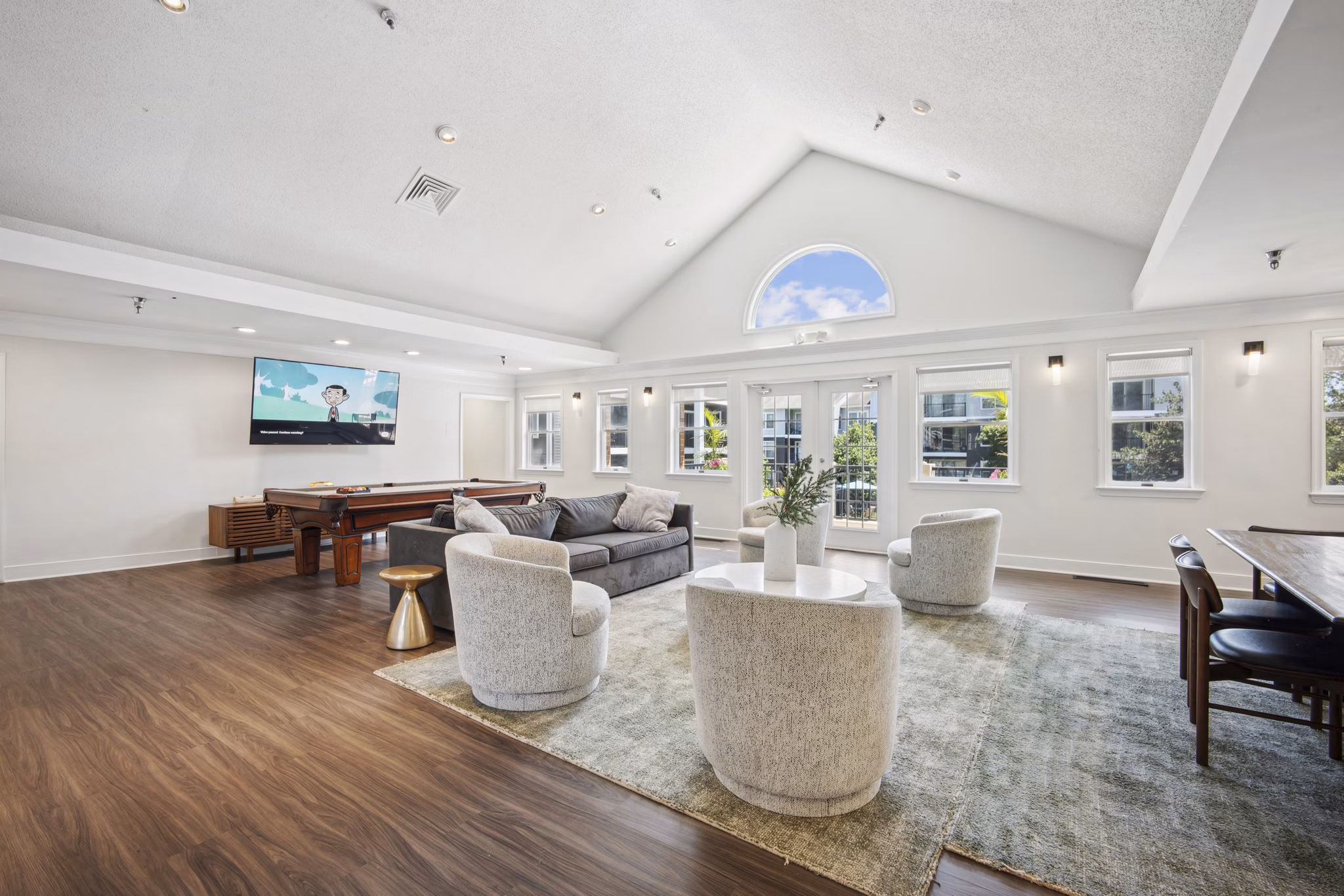 Modern clubhouse with lounge seating at Columbia Crossing Apartments