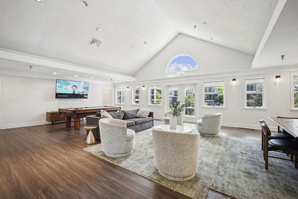 Modern clubhouse with lounge seating at Columbia Crossing Apartments