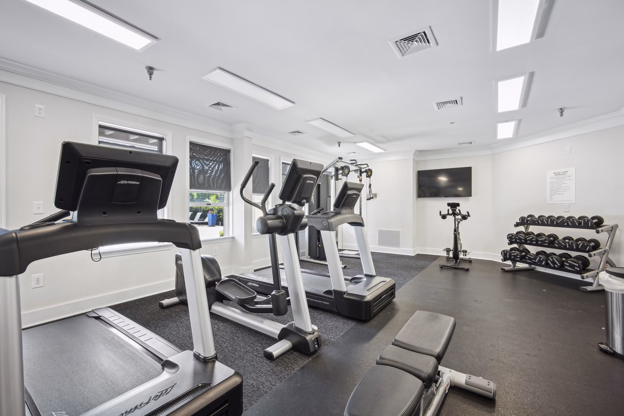 Modern fitness center with state-of-the-art equipment at Columbia Crossing Apartments