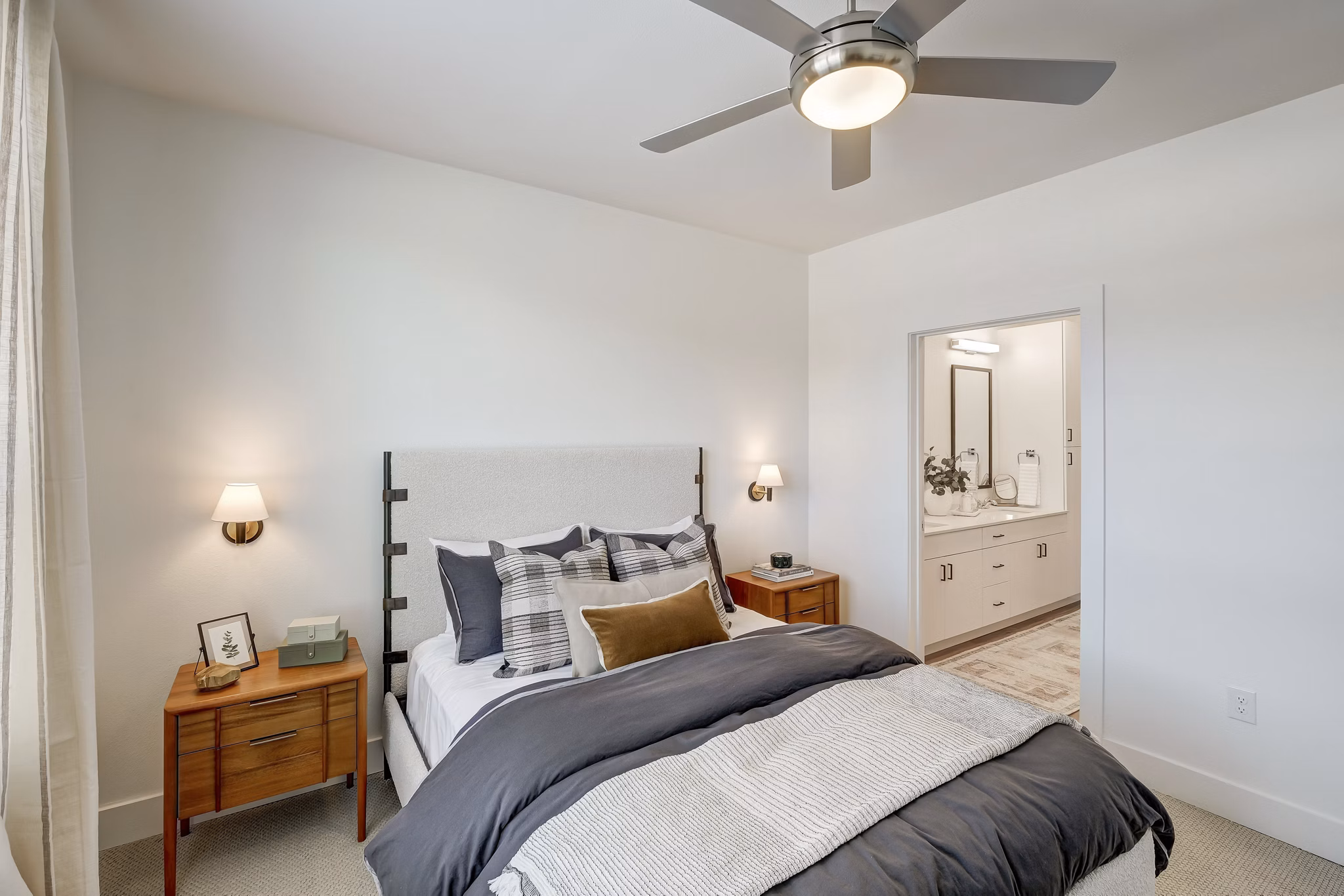 The Taylor at Greenway Apartments: Cozy bedroom with elegant decor and ample natural light