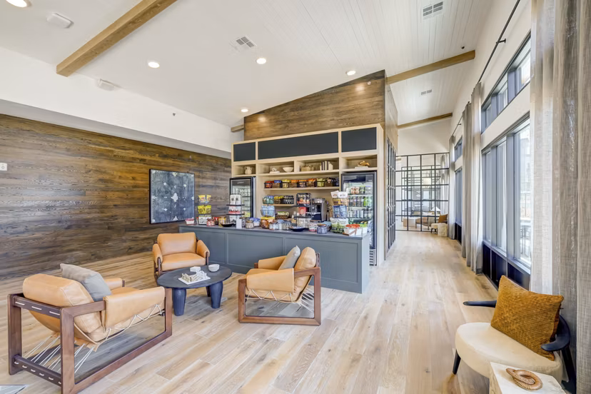 The Taylor at Greenway: Stylish clubhouse with modern decor and lounge seating in luxury apartments complex