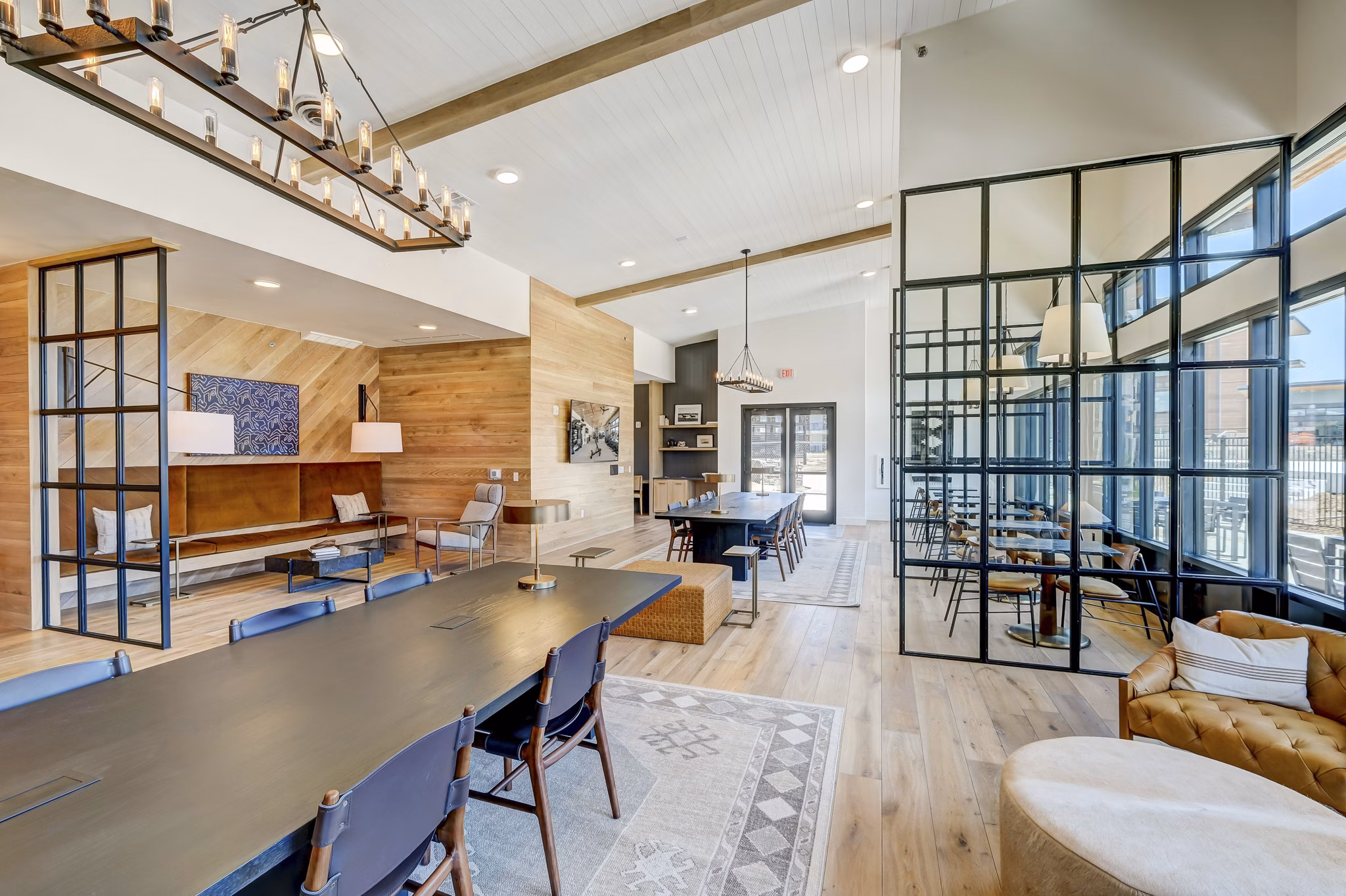 Clubhouse with modern decor and seating at The Taylor at Greenway Apartments, Houston Perfect for social gatherings and relaxation
