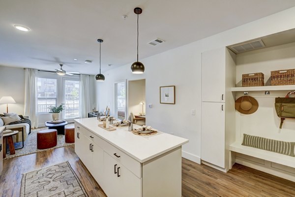Modern kitchen with stainless steel appliances at The Taylor at Greenway Apartments in Houston, Texas