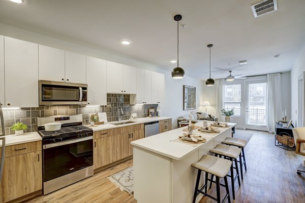 Modern kitchen with stainless steel appliances at The Taylor at Greenway Apartments