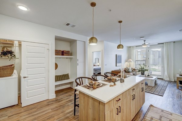 Modern kitchen with stainless steel appliances at The Taylor at Greenway Apartments