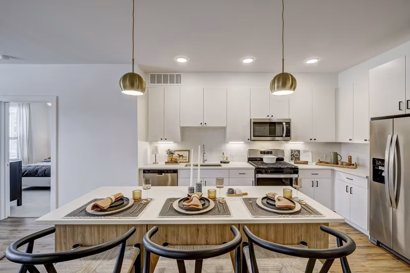 The Taylor at Greenway Apartments: Modern kitchen with sleek countertops and stainless-steel appliances
