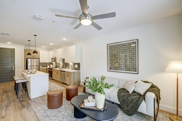 Spacious living room with modern furnishings at The Taylor at Greenway Apartments in Houston