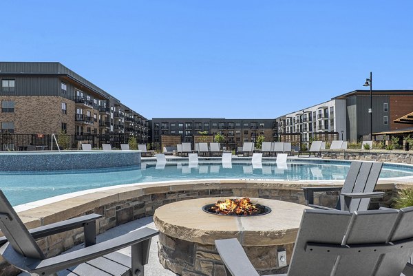 Modern fire pit and pool area at The Taylor at Greenway Apartments offering relaxation and luxury living amenities