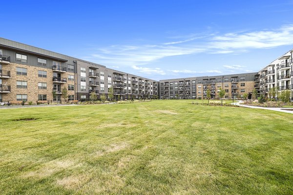Courtyard featuring manicured gardens at The Taylor at Greenway Apartments, luxury living in a serene setting