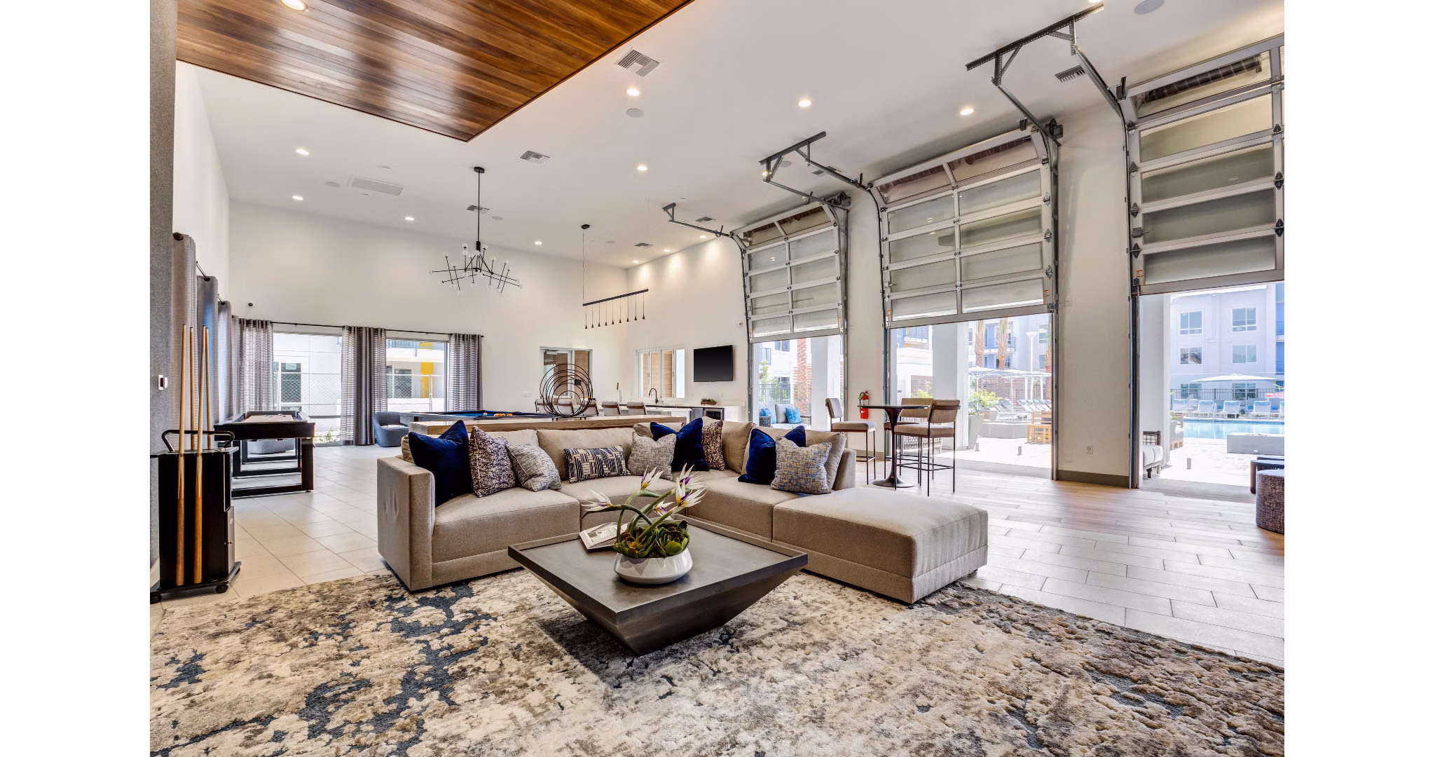 Clubhouse featuring modern design and comfortable seating at The Eisley Apartments, luxury community by Greystar