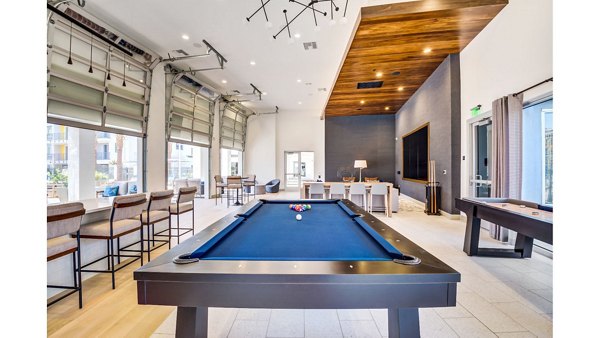 The Eisley Apartments: Elegant clubhouse featuring modern design and cozy seating areas in urban Sacramento