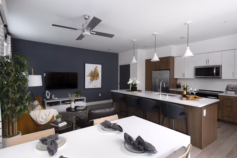 Dining area with elegant decor and modern seating at The Eisley Apartments