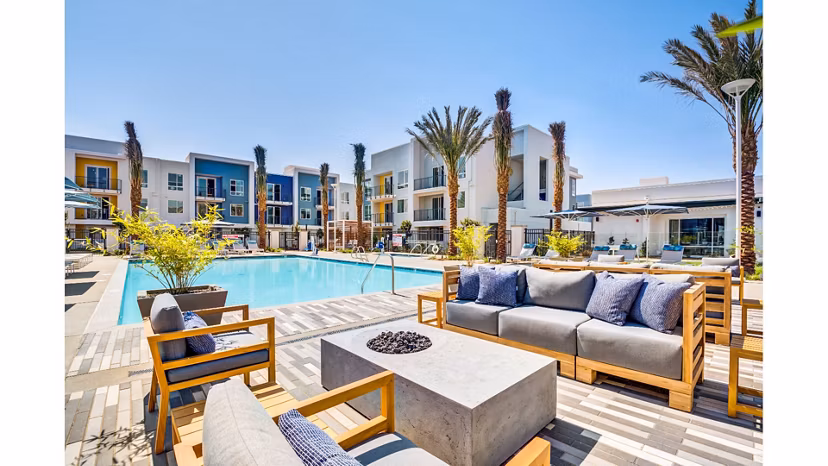 Cozy outdoor fire pit area at The Eisley Apartments, perfect for evening gatherings