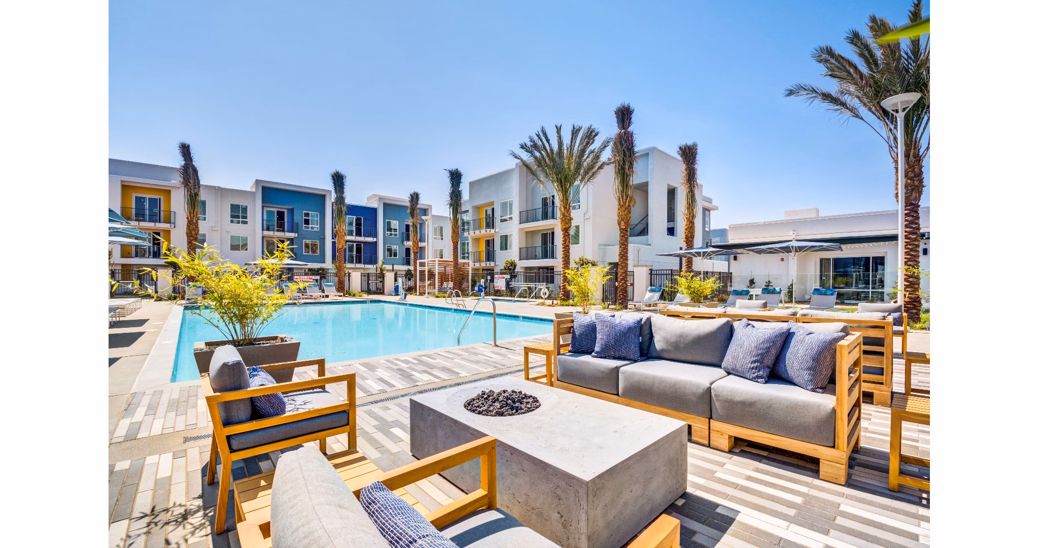 Cozy outdoor fire pit area at The Eisley Apartments, perfect for evening gatherings