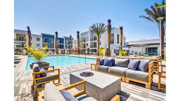 Cozy outdoor fire pit area at The Eisley Apartments, perfect for evening gatherings