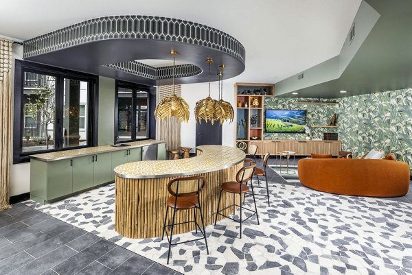 Clubhouse lobby with modern seating and lighting at Broadstone Berry Hill Apartments