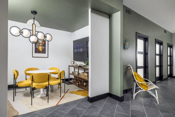 Clubhouse business center with modern workstations at Broadstone Berry Hill Apartments