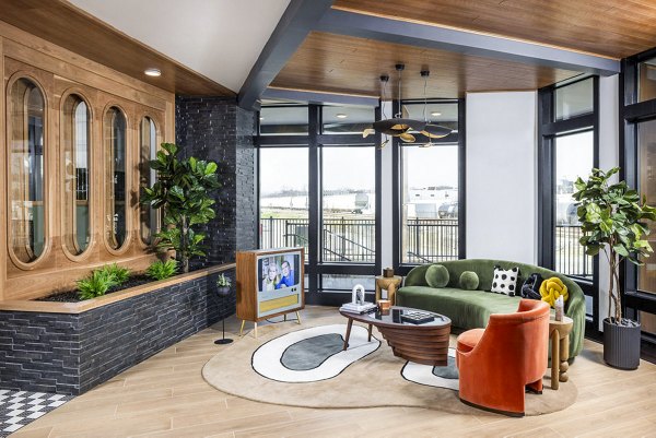 Modern clubhouse featuring stylish seating and billiard table at Broadstone Berry Hill Apartments