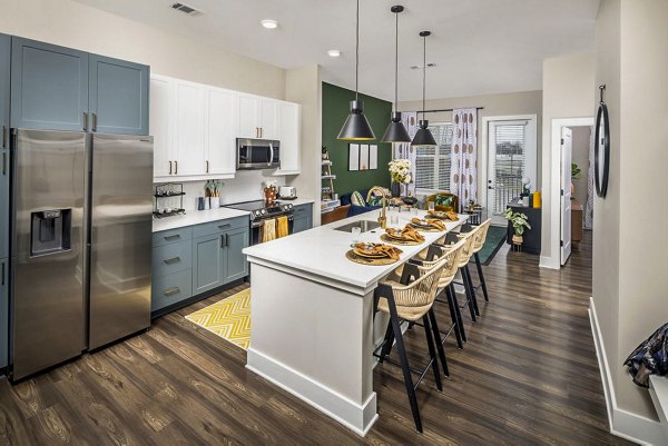 Spacious kitchen featuring modern appliances and ample counter space in Broadstone Berry Hill Apartments