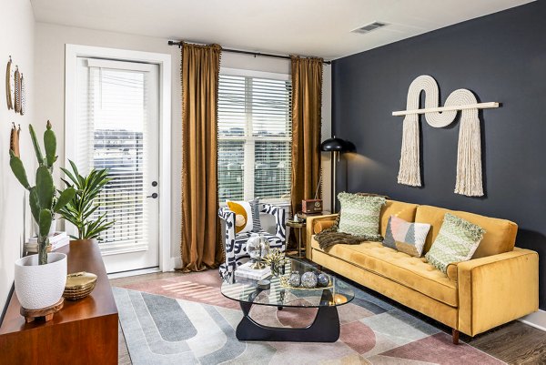 Contemporary living room with plush seating at Broadstone Berry Hill Apartments