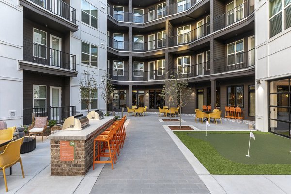 Peaceful courtyard with lush greenery at Broadstone Berry Hill, luxury apartments offering serene outdoor spaces