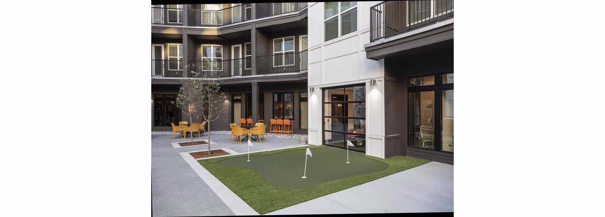 Putting green surrounded by lush landscaping at Broadstone Berry Hill luxury apartments