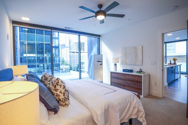 Cozy bedroom with modern dÃ©cor at Novel Midtown Apartments