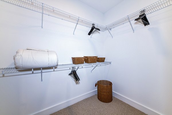 Bedroom closet with ample storage space in Novel Midtown Apartments