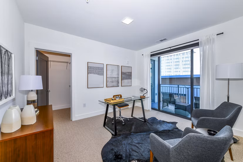 Bedroom featuring elegant decor and natural light at Novel Midtown Apartments